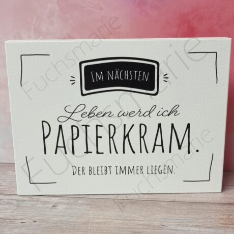 Holzbild mit Text: Im nächsten Leben werd ich Papierkram. Der bleibt immer liegen.