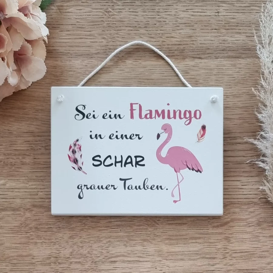Sei ein Flamingo in einer Schar grauer Tauben