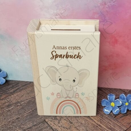 Sparbuch aus Holz mit Motiv Elefant auf Regenbogen